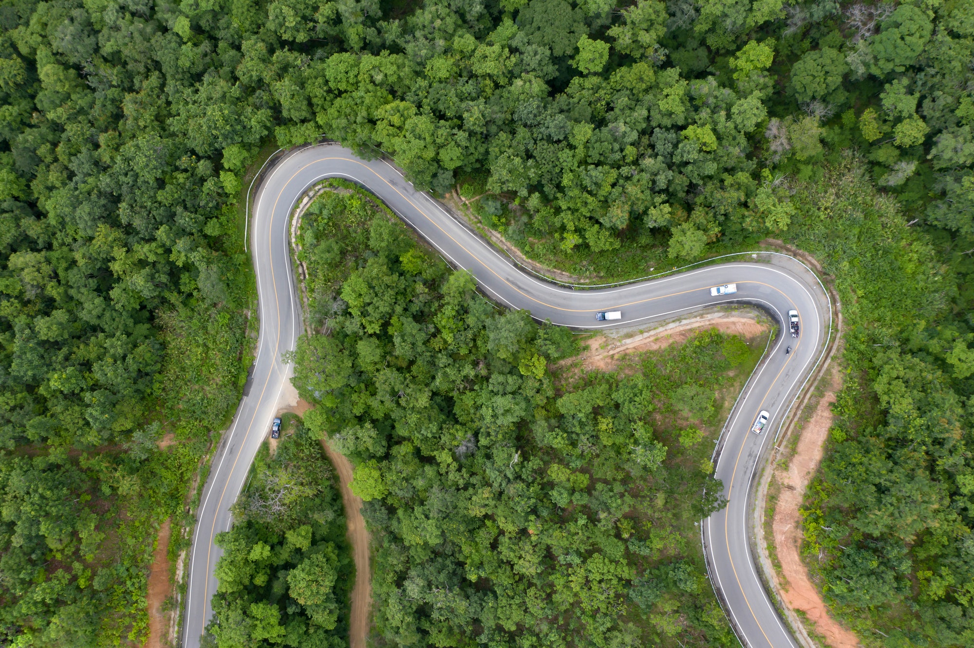 Drone view of curvng road .