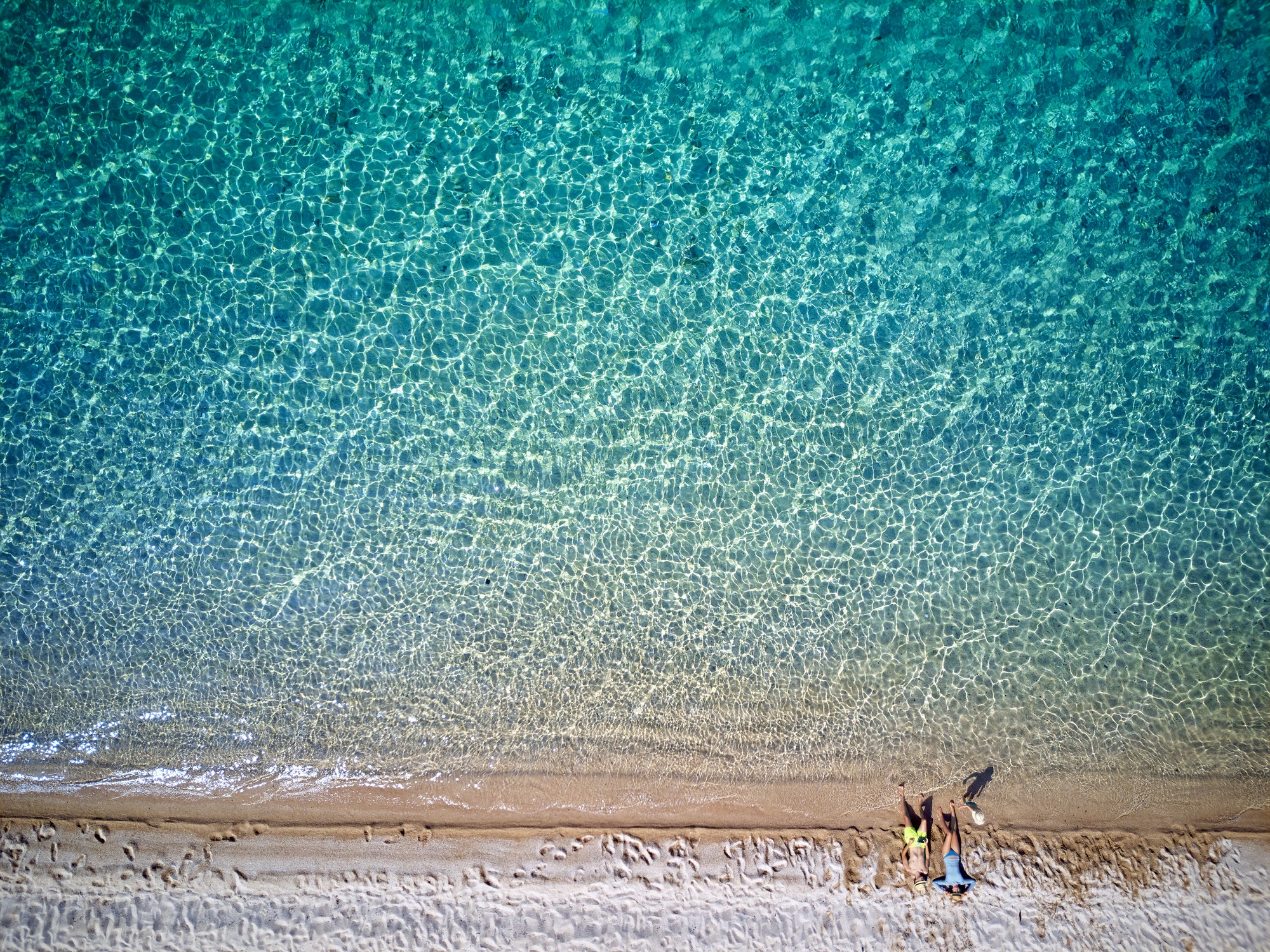 Beautiful beach with family drone shot